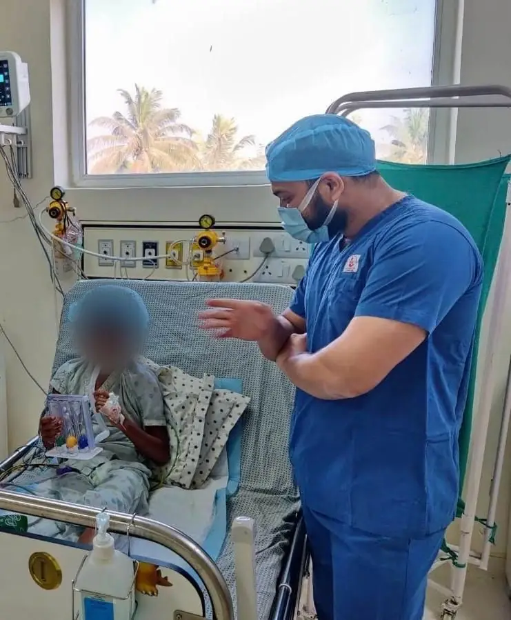 Dr. Shubham Jawale with hospital pediatric patient
